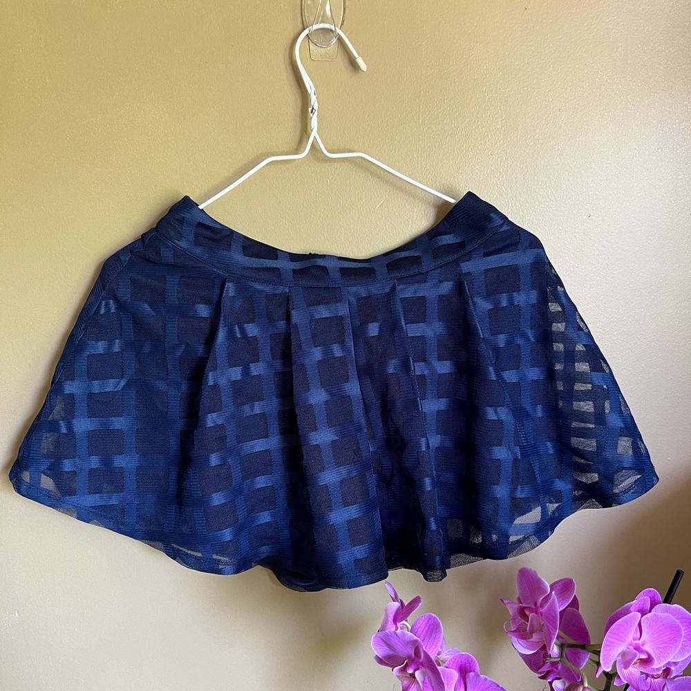 Navy blue skirt with shorts underneath.